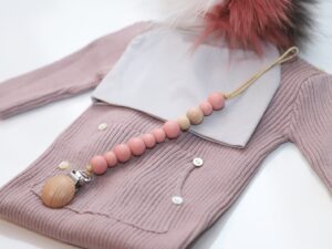 Perfect First Gift: Dummy chain, Hat, Babygrow.