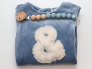 Newborn Gift: Babygrow, Dummy chain.